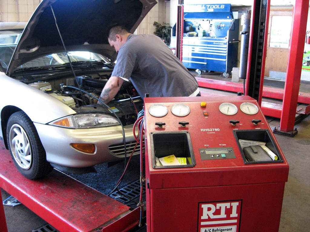 How do you repair a broken air conditioning hose on a car?